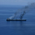 FILE PHOTO: Flames and smoke rise from the Greek-flagged oil tanker Sounion in the Red Sea, August 25, 2024. Yemen's Houthis say they attacked Sounion in the Red Sea. /Hanout via REUTERS/File Photo